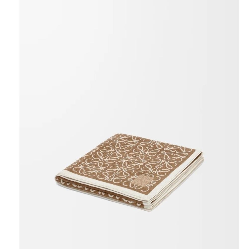 $750 Loewe Anagram towel in cotton